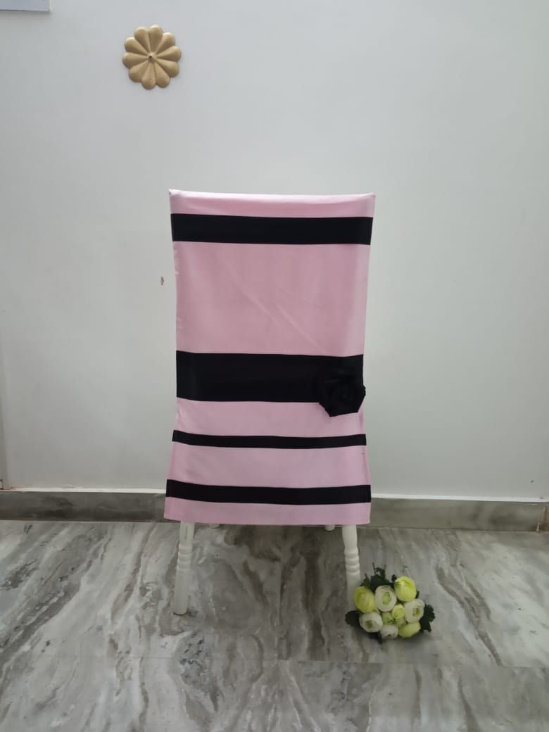 Pink crush chair cover with black ribbon strips