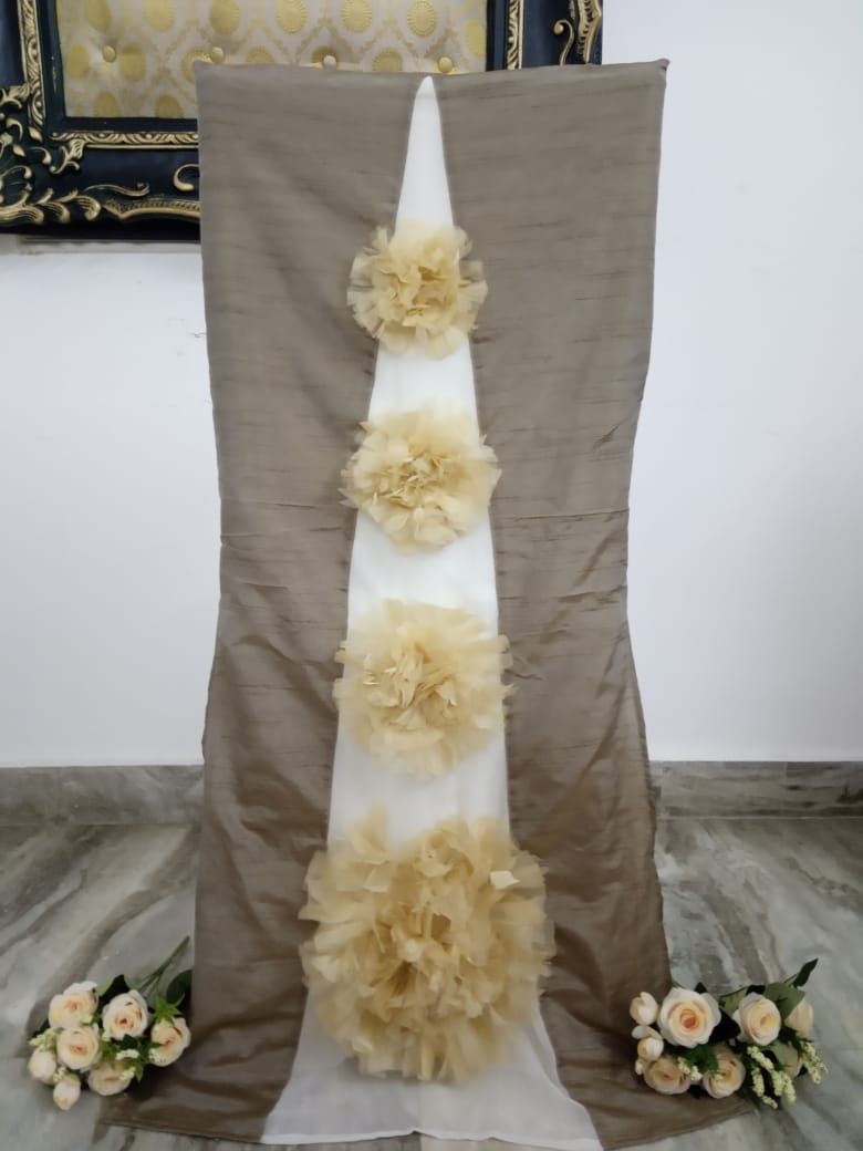 Light brown and white liza chair cover with golden organza flowers