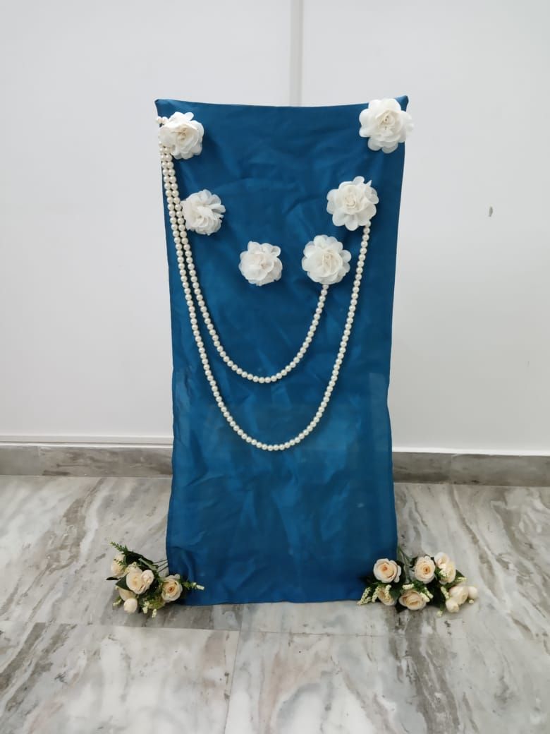 Teal blue raw silk chair cover with white flowers and pearl strings